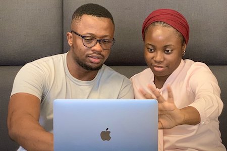 Two people working at a computer